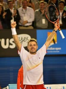 Switzerland's Stanislas Wawrinka celebrates after victory in his men's singles match against Serbia's Novak Djokovic on day nine at the 2014 Australian Open tennis tournament in Melbourne on January 21, 2014. IMAGE RESTRICTED TO EDITORIAL USE - STRICTLY NO COMMERCIAL USE AFP PHOTO / PAUL CROCK