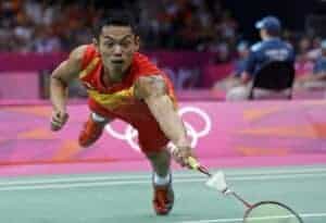 China's Lin Dan dives for a return while playing against Sho Sasaki, of Japan, in a men's singles badminton quarterfinal match at the 2012 Summer Olympics, Thursday, Aug. 2, 2012, in London. (AP Photo/Andres Leighton)